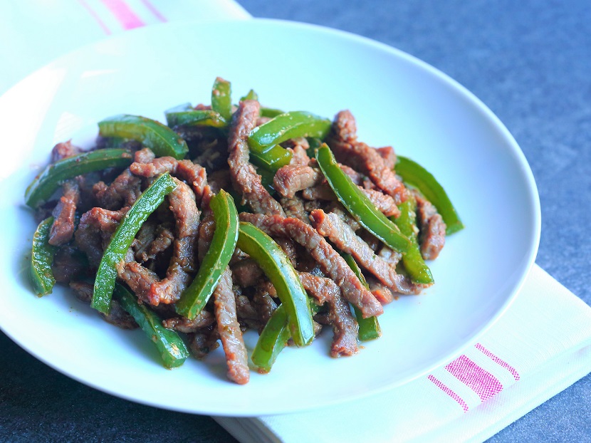 Chinese "velveting" technique makes the beef tender and moist in this delightful stir-fry with green peppers.