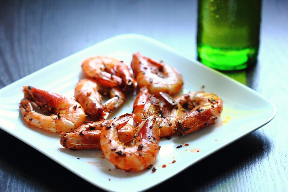 Stir-fried head-on shrimp with black pepper, garlic, and Shaoxing wine, creating an explosion of peppery and smoky flavors on the outside and sweet, juicy, and tender flesh inside the shells.