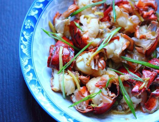 In this delightful dish, the minimalist approach of Cantonese cooking— using just soy sauce, ginger, and scallions—allows the natural flavors of the lobster shine brightly.