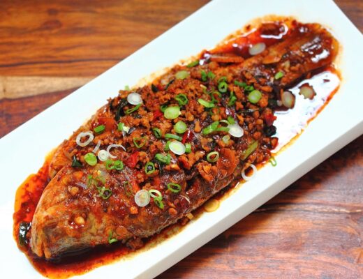 In this iconic Sichuanese dish, drying-brasing the fish with dou ban jiang and pork creates a rich and flavorful sauce that drapes the fish.
