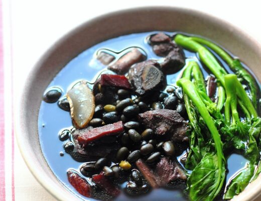 The hearty soup of black soybeans, pork ribs, ham, and gai lan (Chinese broccoli) is tasty and nurishing.