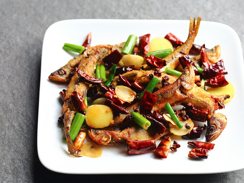 Chilies and Sichuan peppercorns bring excitement to the fried smelt—inspired by the famous Sichuanese dish "Chicken with Chilies" or La Zi Ji (辣子鸡) in Mandarin.