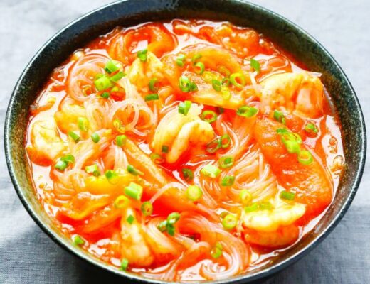 A hot, comforting bowl of noodle soup made with three versatile ingredients: cellophane noodles (glass noodles), tomatoes, and shrimp.
