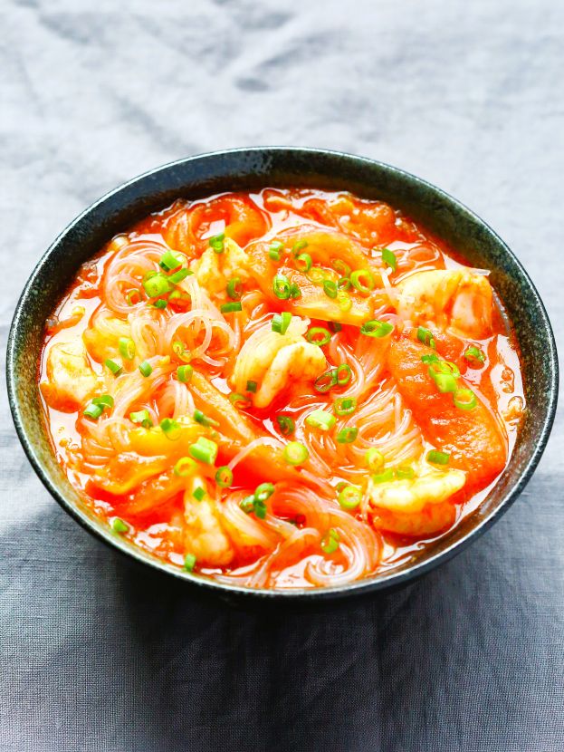 A hot, comforting bowl of noodle soup made with three versatile ingredients: cellophane noodles (glass noodles), tomatoes, and shrimp.